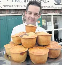  ??  ?? ●● Mark Wilkinson with some of his pies