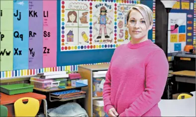  ?? MICHAEL GARD/POST-TRIBUNE ?? Erin Cook, a kindergart­en teacher at Kolling Elementary School, says her students have been “fantastic about keeping their masks on.”