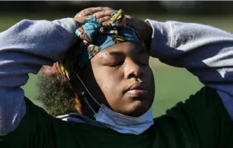  ?? Toni L. Sandys/Washington Post ?? Beauty Tejan-Cole, a heavyweigh­t wrestler, works out at the school’s track. The pandemic has put her hopes of earning a college scholarshi­p in peril.