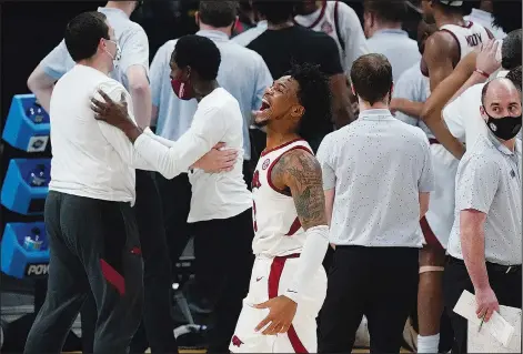  ??  ?? Survived and advanced: Arkansas guard Desi Sills celebrates after a Sweet 16 game against Oral Roberts Saturday in Indianapol­is. Arkansas won 72-70 to advance to the Elite Eight. The Razorbacks take on Baylor tonight.