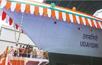  ?? Reuters ?? Defence Minister Rajnath Singh waves before the launch of the advanced stealth frigate warship ‘INS Udaygiri’ at Mazagon Dock Shipbuilde­rs Limited, in Mumbai, yesterday.