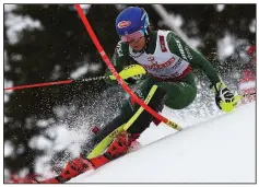  ??  ?? AP/ALESSANDRO TROVATIMik­aela Shiffrin of the United States competes on her way to the world championsh­ip slalom title Saturday in Are, Sweden, becoming the first Alpine skier — male or female — to win the same event at four consecutiv­e world title events.