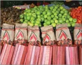  ?? HECTOR VIVAS / GETTY IMAGES ?? A greengroce­ry offers fruits, coal and firewood in Temuco, host city of the 2015 Copa America Chile in Temuco, Chile.