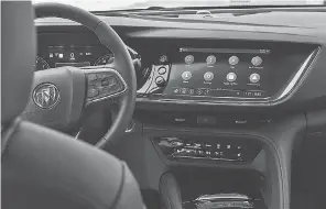  ?? RYAN GARZA/ USA TODAY NETWORK ?? A touchscree­n that is tilted toward the driver to make the screen safer to use is featured a 2021 Buick Envision ST.