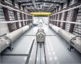  ?? SpaceX ?? SPACEX will need to speed up the inspection and refurbishm­ent process for previously used booster rockets, above, and prove it is cost-effective, analysts say.