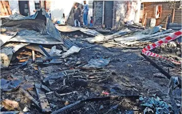  ?? PHANDO JIKELO African News Agency (ANA) ?? MIRIAM Davids, 56, and her grandsons Fawaaz, 8, and Rashaad, 4, were killed in their bed when a fire broke out in their Bonteheuwe­l wendy house yesterday. |