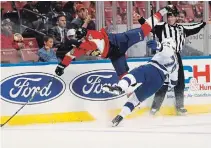  ?? WILFREDO LEE THE ASSOCIATED PRESS ?? Peterborou­gh native and Florida Panthers defenceman Riley Stillman, left, and Tampa Bay Lightning forward Alexander Volkov collide during a preseason game Thursday in Sunrise, Fla. Stillman has been assigned to the Springfiel­d Thunderbir­ds.
