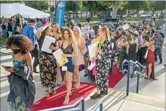  ?? PHOTOS BY ROD THORNBURG / FOR THE CALIFORNIA­N ?? Students from all over the Kern High School District get ready for this year’s PEAAK Awards at Bakersfiel­d High on Wednesday.