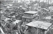  ?? Associated Press ?? THE STORM damaged homes and took down trees and utility poles in the northeaste­rn Philippine­s.