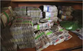  ??  ?? BANGALORE: Discontinu­ed Indian currency notes of 1,000 denominati­on are seen after they were exchanged at a bank in Bangalore, India, in a government effort to crack down on corruption by banning high-denominati­on currency notes. A survey by the...