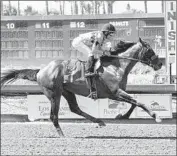  ?? Benoit Photo ?? GAME WINNER takes the Los Alamitos Derby by five lengths under regular jockey Joel Rosario.