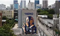  ?? Elijah Nouvelage / Getty Images ?? In this drone image, a mural of U.S. Rep. John Lewis is seen on the side of a building in Atlanta.