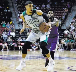  ?? Chase Stevens ?? Las Vegas Review-journal @csstevensp­hoto Jayson Tatum of the Celtics works inside against the Philadelph­ia 76ers during an NBA Summer League game on Tuesday.