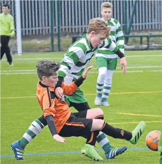  ??  ?? Celtic Boys (green and white) saw off Dundee United SC in a free-scoring encounter at Craigie 3G to stay top of the U/13s Cafe Royal League.