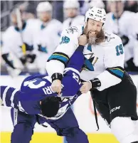  ?? FRANK GUNN / THE CANADIAN PRESS ?? Nazem Kadri of the Leafs gets a handful of beard in his fight with Joe Thornton on Thursday.