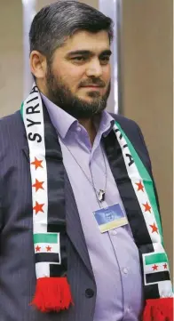  ??  ?? Mohammed Alloush a Ginevra lo scorso 22 marzo ha incontrato il mediatore dell’Onu Staffan de Mistura, in occasione dei colloqui di pace per la Siria.