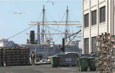  ?? Liz Hafalia / The Chronicle ?? Crab nets sit unused at Pier 45 at Fisherman’s Wharf in early November. The opening of the commercial Dungeness crab season has now been pushed back twice to protect whales and sea turtles.