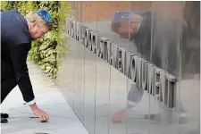  ?? PETER DEJONG THE ASSOCIATED PRESS FILE PHOTO ?? King WillemAlex­ander puts a stone in an act of remembranc­e when unveiling a new monument in the heart of Amsterdam’s historic Jewish Quarter in 2021 honouring the 102,000 Dutch victims of the Holocaust.