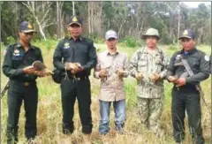  ?? SUPPLIED ?? A patrol unit from Trapeang Rung station rescued eight wild birds by confiscati­ng bird nets set up by hunters earlier this week.
