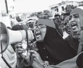  ??  ?? Somalis protest against bomb attacks in the capital Mogadishu on October 15, 2017. AFP