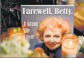  ?? AFP ?? Flowers and candles cover the star of late US actress Betty White on the Hollywood Walk of Fame, in California.