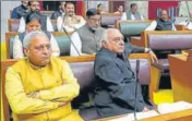  ?? KESHAV SINGH/HT ?? Leader of opposition Bhupinder Singh Hooda with other Congress legislator­s in the Haryana assembly on Tuesday; and (right) chief minister Manohar Lal Khattar speaking in the House as deputy chief minister Dushyant Chautala looks on.