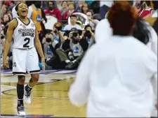  ?? SEAN D. ELLIOT/THE DAY ?? Mississipp­i State’s Morgan William goes to the bench celebratin­g as time expires on the Bulldogs’ 73-63 overtime win over Louisville in the first of two national semifinal games on Friday night at Nationwide Center in Columbus, Ohio.