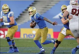  ?? Ringo H.W. Chiu Associated Press ?? DORIAN THOMPSON-ROBINSON has been UCLA’s quarterbac­k during most of Chip Kelly’s three seasons, in which the Bruins have gone 10-21.