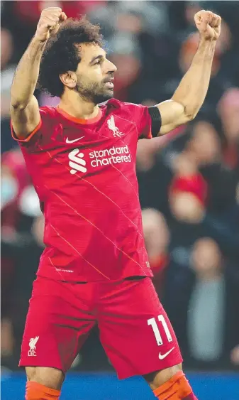  ?? ?? Mohamed Salah after slotting the spot kick that ruined the return to Anfield of Steven Gerrard (inset). Picture: Getty Images