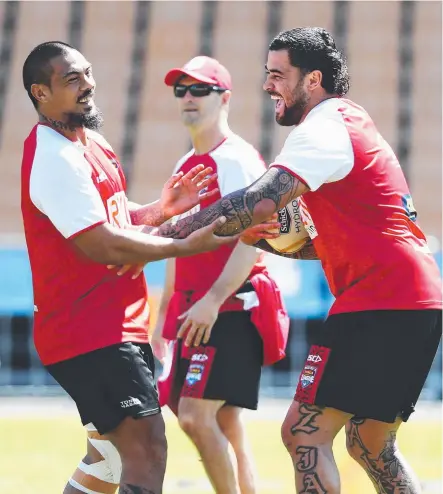  ?? OUTSPOKEN: Andrew Fifita ( right) and Sika Manu share a laugh during Tonga training in Auckland yesterday. ??