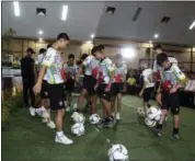  ?? CHIANG RAI PUBLIC RELATIONS DEPARTMENT VIA AP ?? Members of the rescued soccer team show their skills before a press conference regarding their experience being trapped in the cave in Chiang Rai, northern Thailand.