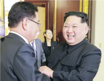  ?? KCNA VIA KNS / AFP / GETTY IMAGES ?? North Korean leader Kim Jong Un, right, shakes hands with South Korean envoy Chung Eui-yong Monday.