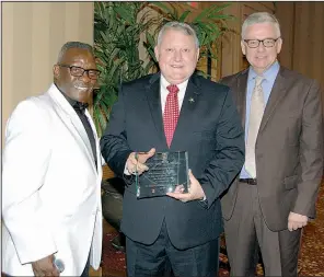  ??  ?? Michael Johninson Sr. with Doc Holladay and the Rev. Donnie Copeland