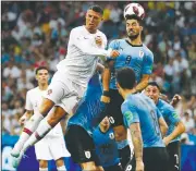  ?? AP/FRANCISCO SECO ?? Portugal’s Cristiano Ronaldo (left) and Uruguay’s Luis Suarez challenge for the ball Saturday during 2018 World Cup play at the Fisht Stadium in Sochi, Russia.