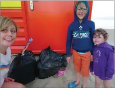  ??  ?? ABOVE: Elaine Parsons with her children Thomas and Susan Howe. RIGHT: Rubbish dumped at overflowin­g skip at Brittas Bay.