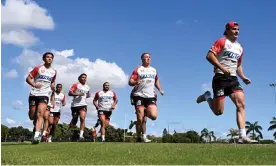  ?? Photograph: Darren England/AAP ?? Dolphins players on the run during the club’s first NRL training session in Redcliffe.