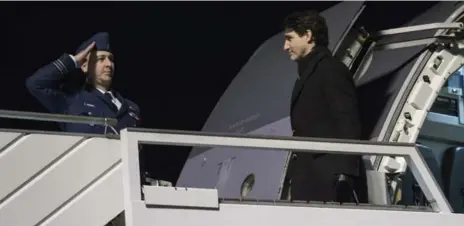  ?? PAUL CHIASSON/THE CANADIAN PRESS ?? Justin Trudeau arrives in Davos, Switzerlan­d, on Monday. At the World Economic Forum, he said gender equality would lead to much-needed innovation.