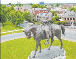  ?? The Associated Press file ?? A statue of Confederat­e General Robert E. Lee on Monument Avenue in Richmond, Va.