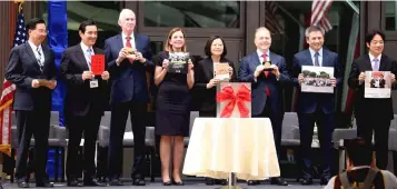  ??  ?? (Left to right) Taiwan’s Foreign Minister Joseph Wu, former President Ma Ying-jeou, Moriarty, Royce, Tsai, Overseas Buildings Office Principal deputy-director Ambassador William Moser and AIT director Kin Moy display their parapherna­lia before placing them in a time capsule during the American Institute in Taiwan (AIT) new office complex dedication ceremony in Taipei. — AFP photo