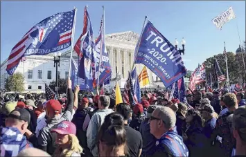  ?? Olivier Douliery / Getty Images ?? Supporters of President Donald Trump rally Saturday at the U.S. Supreme Court in Washington in support of Trump's claim that the Nov. 3 election was fraudulent.