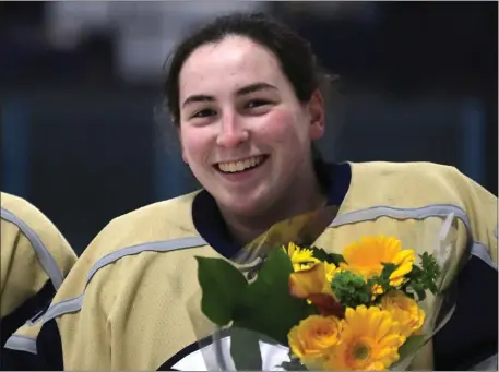  ?? NANCY LANE — BOSTON HERALD ?? St. Mary’s goalie Angelina Catino with flowers on senior night on Wednesday in Stoneham. The program’s former team manager, now a senior, has posted nine shutouts for the 16-1 team.