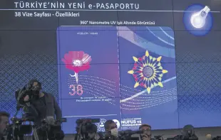  ?? ?? A view of the new Turkish passport projected onto a screen during the press conference, in the capital Ankara, Turkey, May 10, 2022.