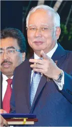  ??  ?? Najib who is also Finance Minister delivering his speech at a ceremony to pay tribute to the dedication of Treasury staff for the years 2015 and 2016 at Putrajaya, Kuala Lumpur, yesterday.