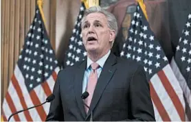  ?? ANDREW HARNIK/AP ?? House Minority Leader Kevin McCarthy speaks before Speaker Nancy Pelosi signed the $2.2 trillion aid package that passed the House on March 27 in Washington.