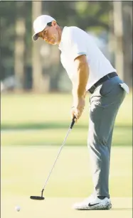  ?? Mike Ehrmann / Getty Images ?? Rory McIlroy putts during practice rounds Wednesday before The Players Championsh­ip at TPC Sawgrass in Ponte Vedra Beach, Fla.