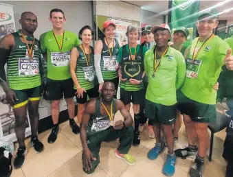  ?? ?? Athletes at at the Nedbank Running Club hospitalit­y suite, from left: Thembaleth­u Mona, Daniel Stevens, Nerida Lubbe, Diana Mouton, Kim Roberts, Annelie Kruger, Liezl Botha and Eddie Mouton. Front: Sam Mandlazi.