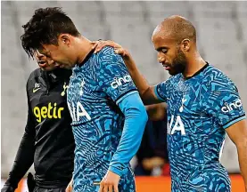  ?? REUTERS ?? Support: a groggy Son is comforted by Lucas Moura