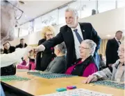  ?? PHIL CARPENTER/ GAZETTE FILES ?? Liberal Leader Philippe Couillard meets seniors as he campaigns at Residence Angelica in Montreal North.