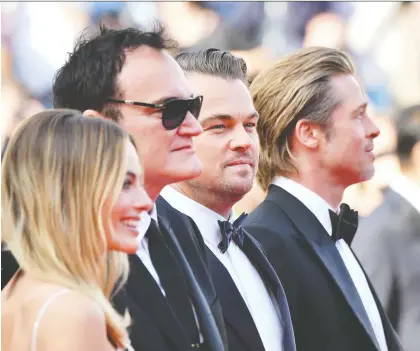  ?? ALBERTO PIZZOLI/GETTY IMAGES ?? Months before opening across North America, the new movie Once Upon a Time ... in Hollywood, by Quentin Tarantino, second from left, and starring Margot Robbie, left, Leonardo Dicaprio and Brad Pitt, was a hit at the Cannes Film Festival ... as were its stars.