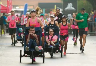  ?? Jason Fochtman ?? Wheelchair participan­ts were among those who competed in Saturday’s 10 for Texas race.